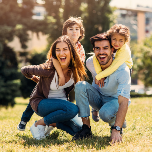 A picture of a happy family wearing clothing. The Little Lemon Store